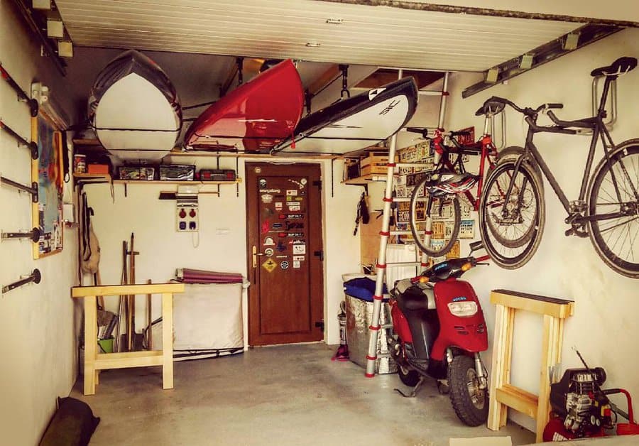 Garage interior with kayaks and red scooter