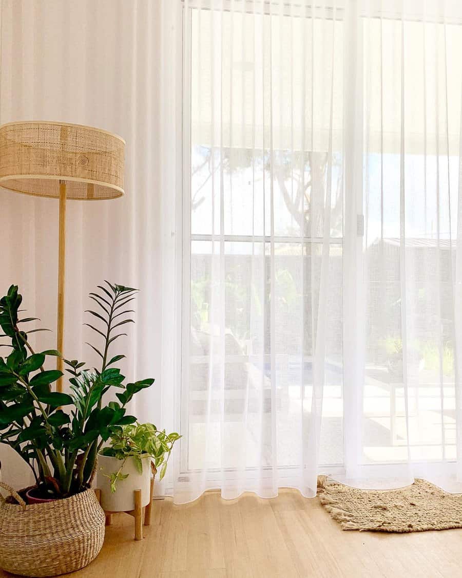 Light filled room with floor-length sheer curtains