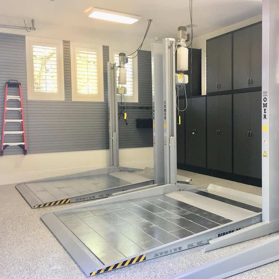 Garage interior with lift and ladder