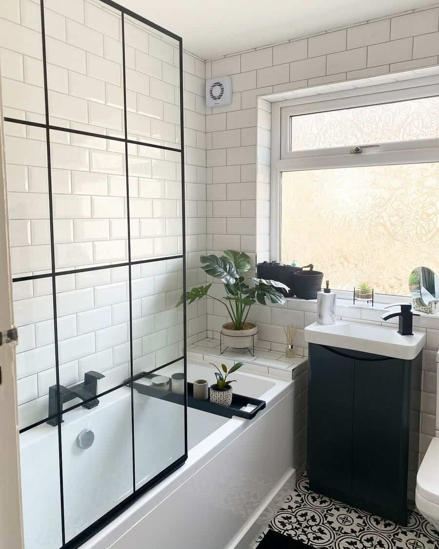 Framed black and white glass bathroom panel