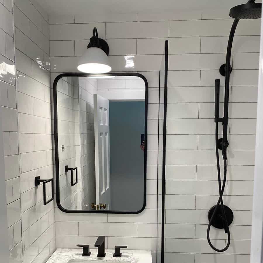 black and white bathroom with subway tiles 
