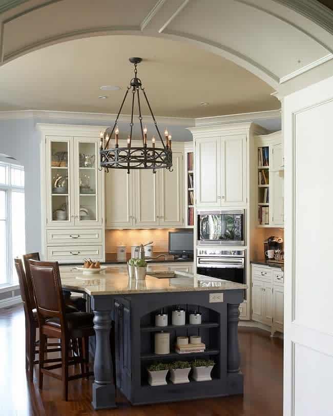 Classic kitchen with arched ceiling and wrought iron chandelier