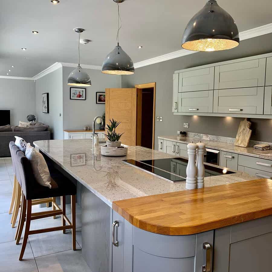 Stylish kitchen with grey tones and dome pendant lights