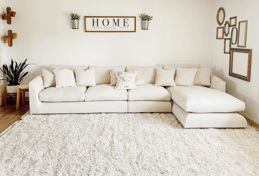 Cozy white living room with framed wall art