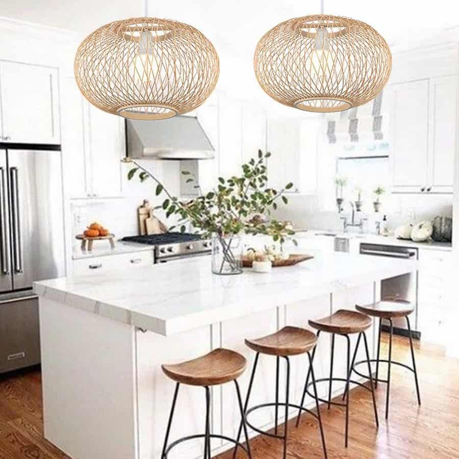 Bright kitchen with woven globe pendants and wooden stools