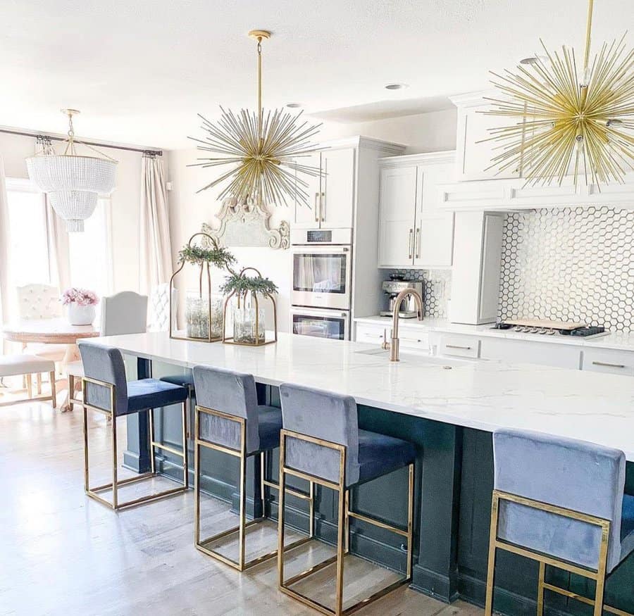 Luxurious kitchen with starburst chandeliers and navy blue accents