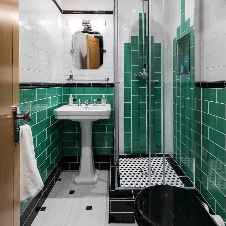 Small bathroom with green beveled tiles 