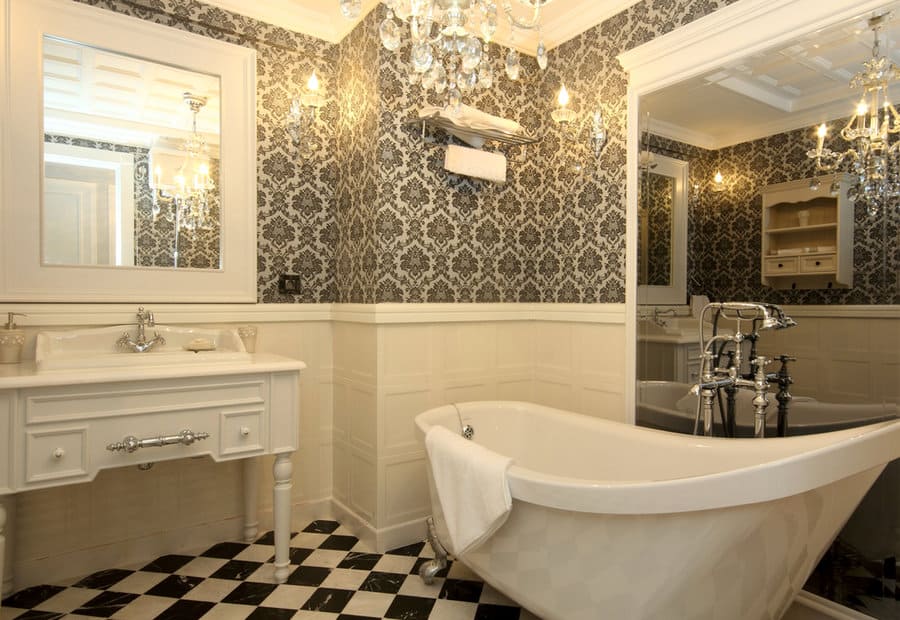 maximalist black and white bathroom with printed walls and checkerboard flooring