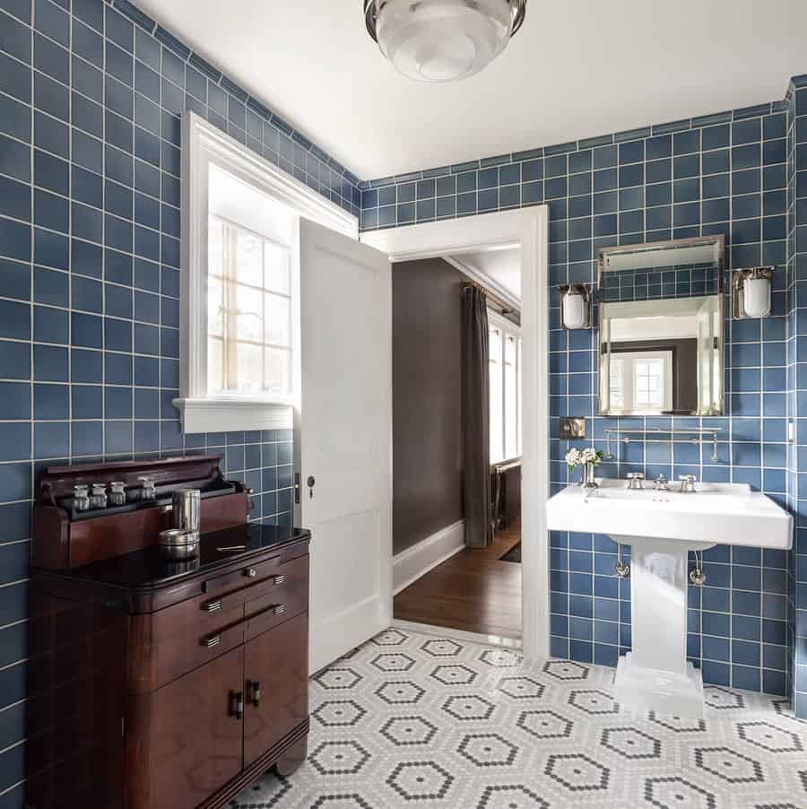 blue bathroom with vintage dresser