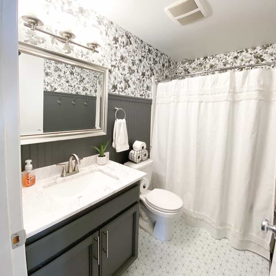 Small bathroom with printed floral wallpaper