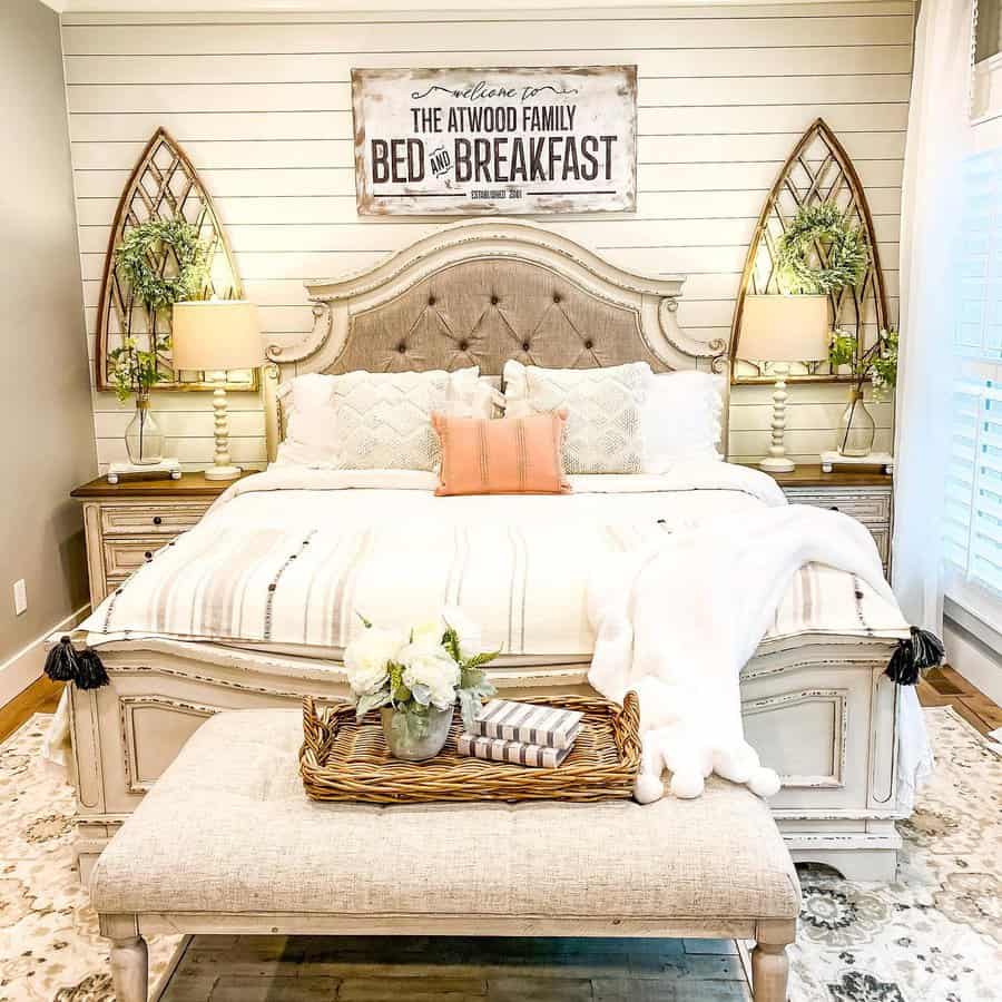 Cozy farmhouse bedroom with personalized bed and breakfast sign