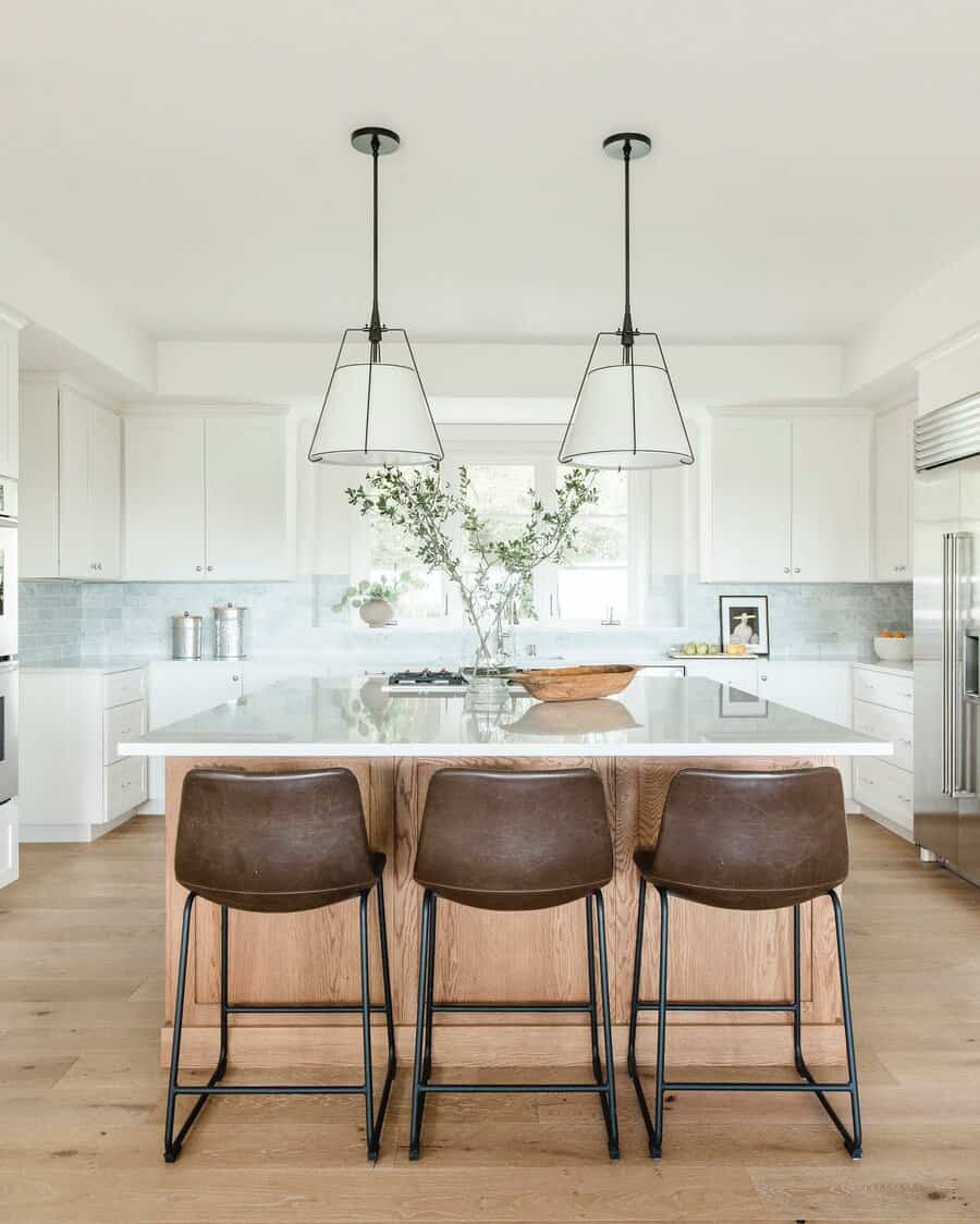 Airy kitchen with large windows and geometric pendant lights