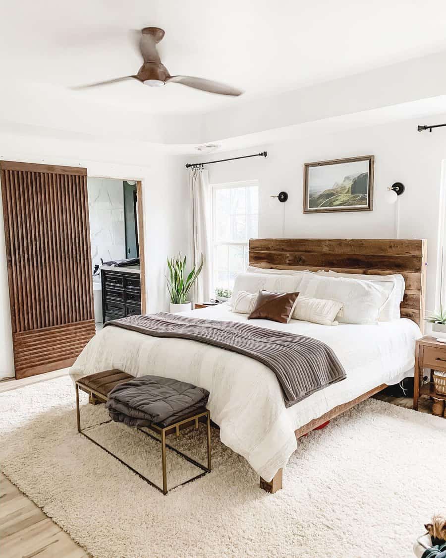 Airy bedroom with a wooden headboard and neutral tones