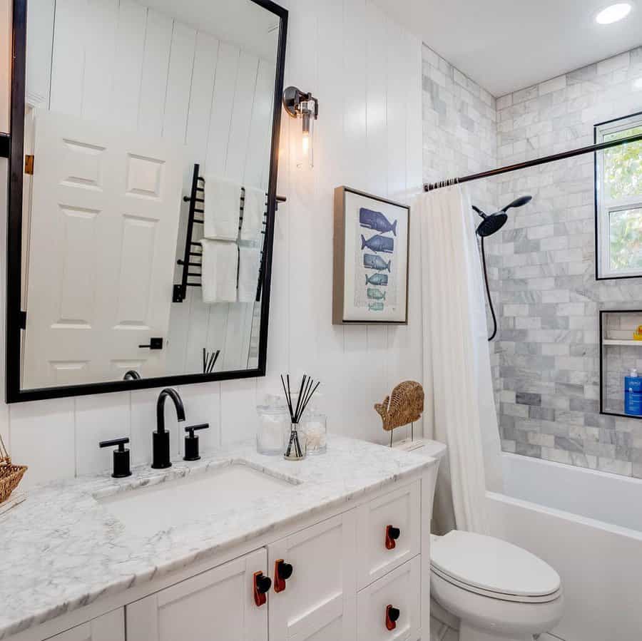 small bathroom with white walls and flooring