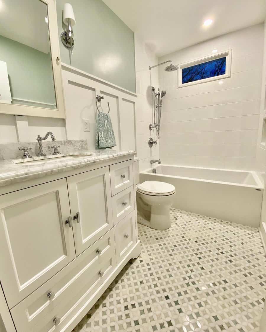 Small bathroom with white walls and flooring