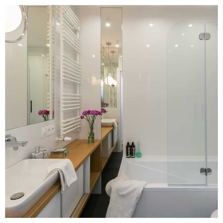 small bathroom with full-length mirror