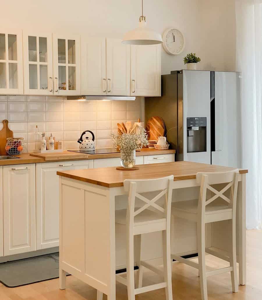 Small kitchen with white wall and cabinets