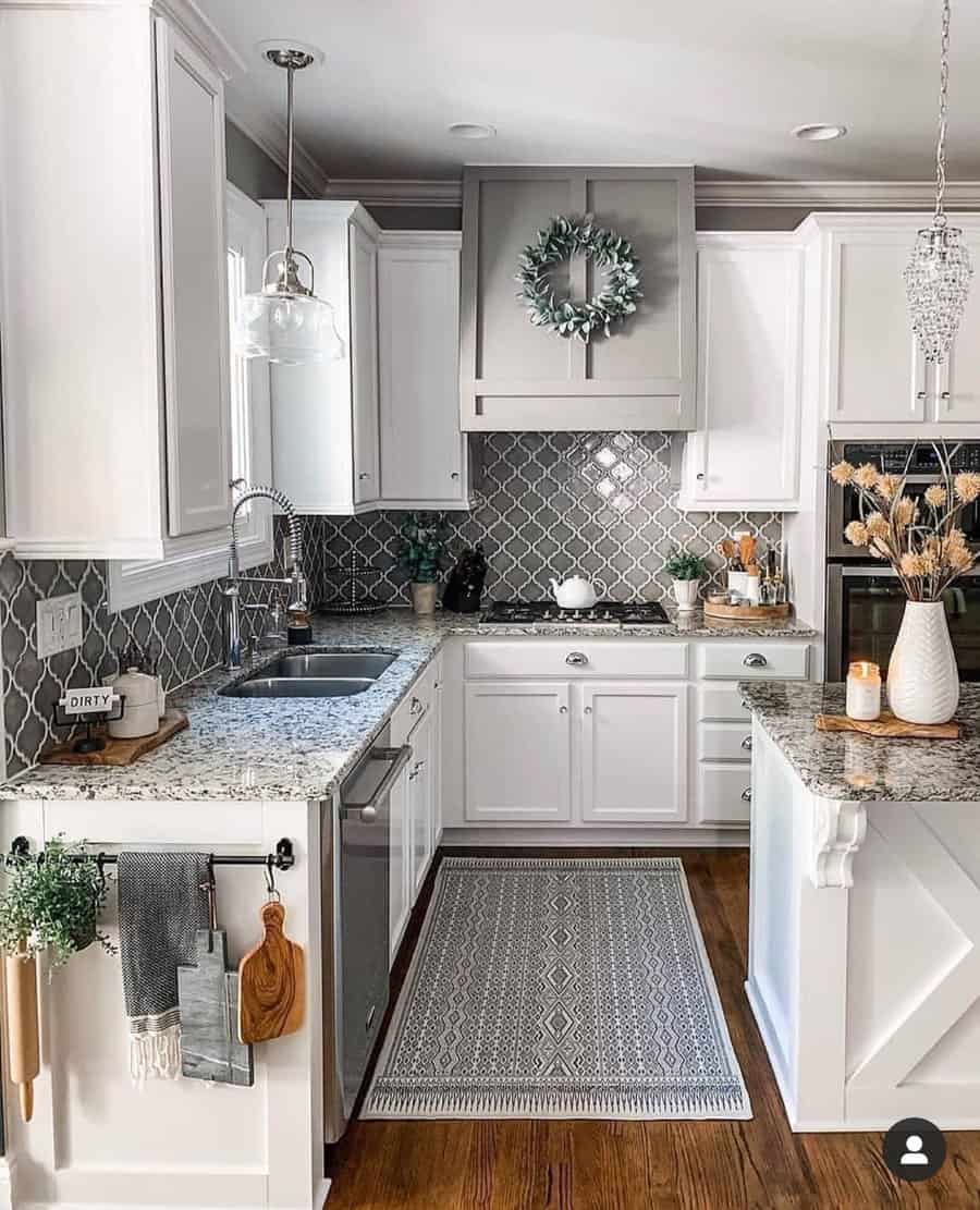 Classic small white kitchen and marble countertop