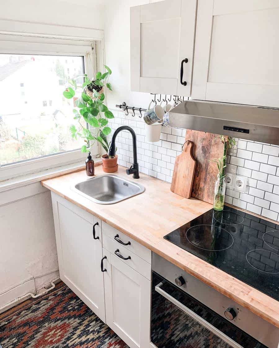 Classic small white kitchen with wood accent