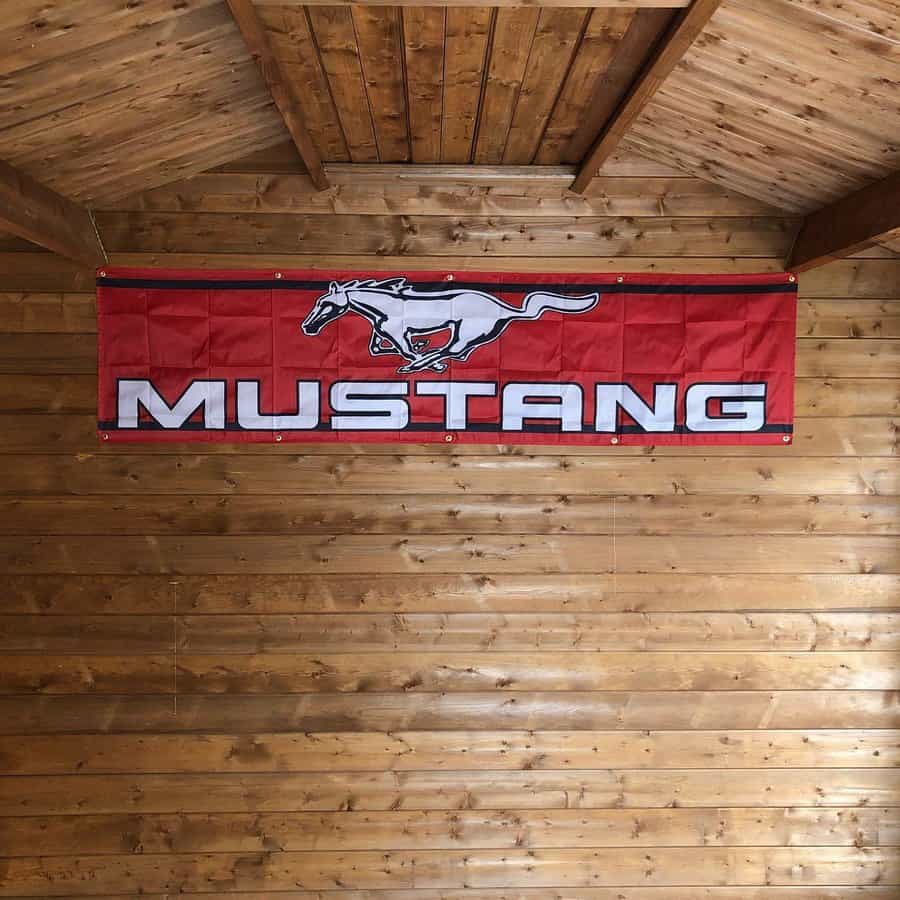 A mustang banner hanging in a barn