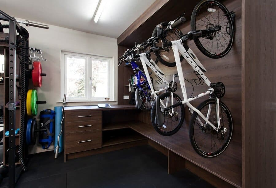 Home gym with a bike rack on the wall