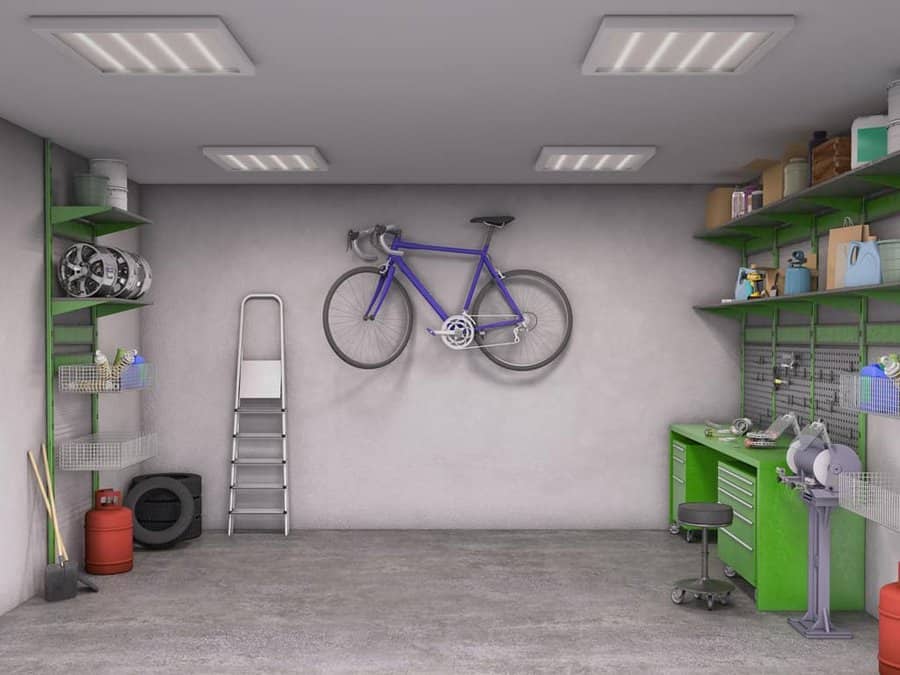 Spacious garage with bike on wall and workbench