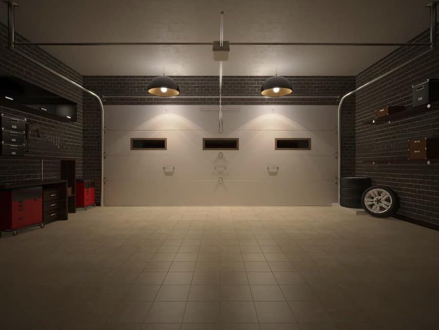 Spacious minimalist garage with tiled floor and brick walls