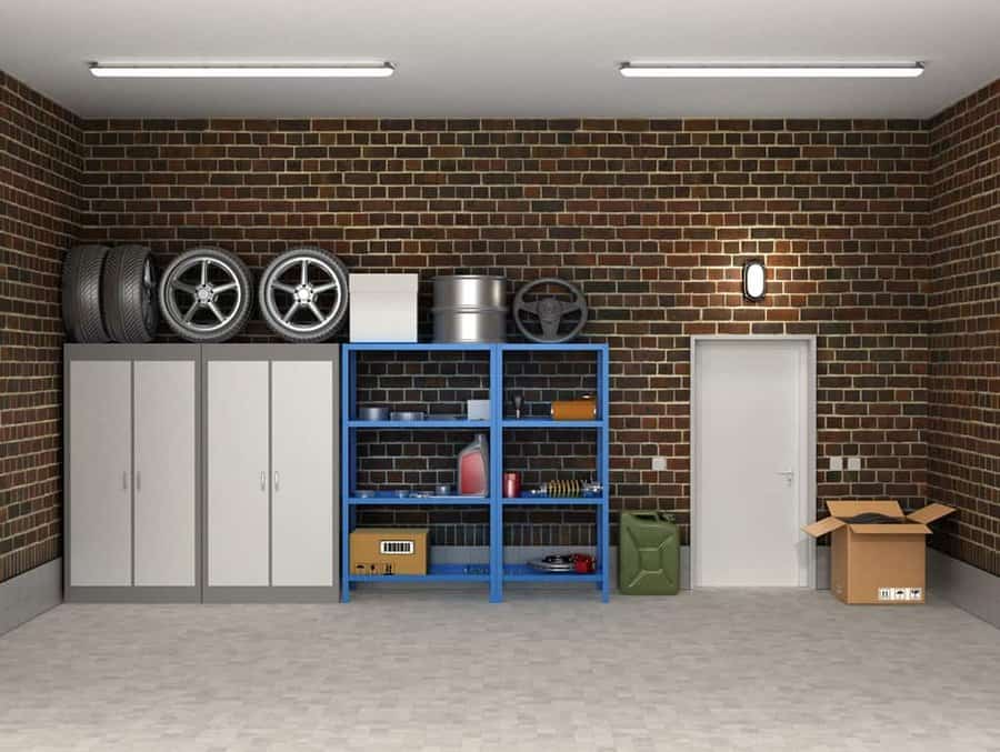 Organized garage with storage shelves and brick walls