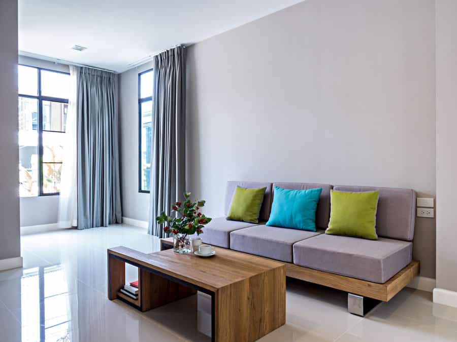 Modern minimalist living room with a sofa and a coffee table