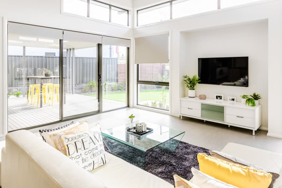 Contemporary white living room with grey area rug