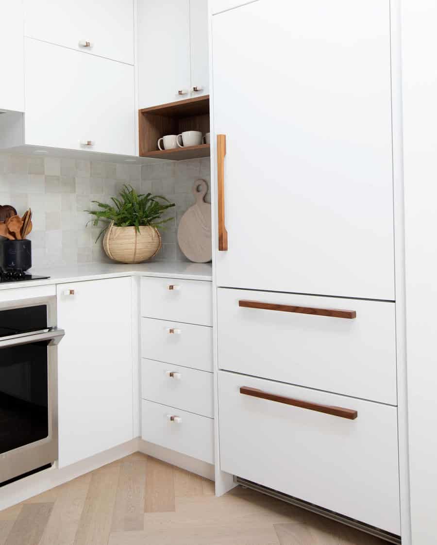 white cabinets with wood handles 