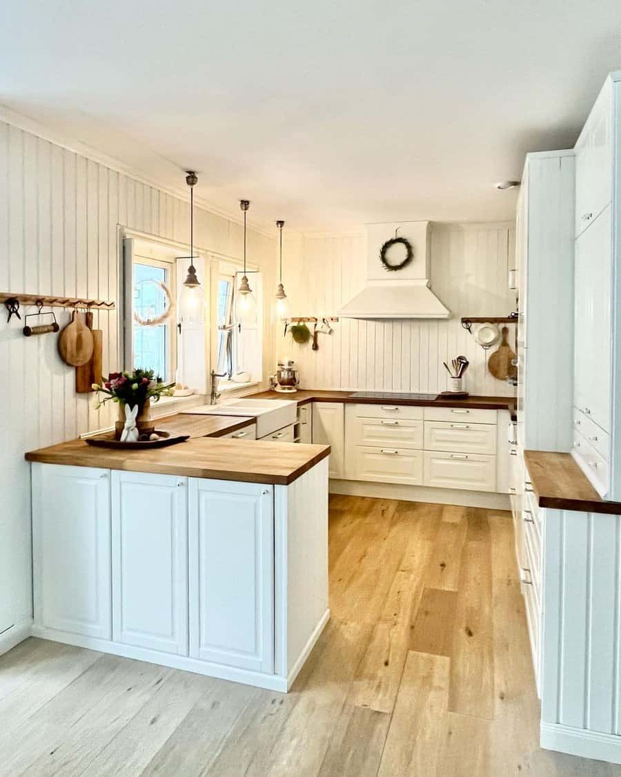 white cabinets with wood countertop