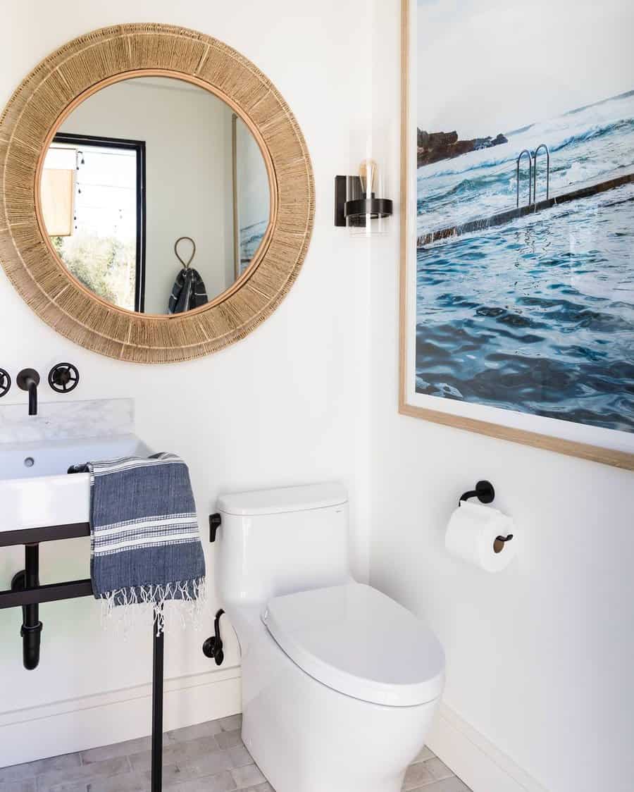 Powder room with round accent mirror