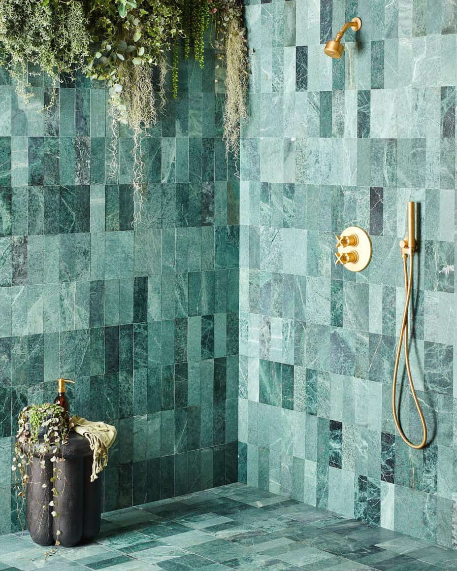 Marble tiled bathroom wall with artificial plants