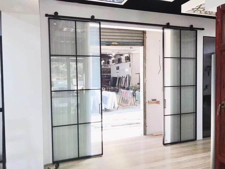 Framed glass barn door