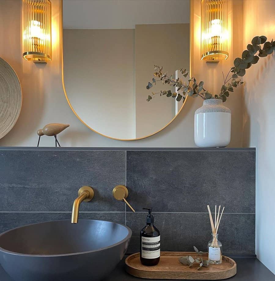 powder room with wall sconces