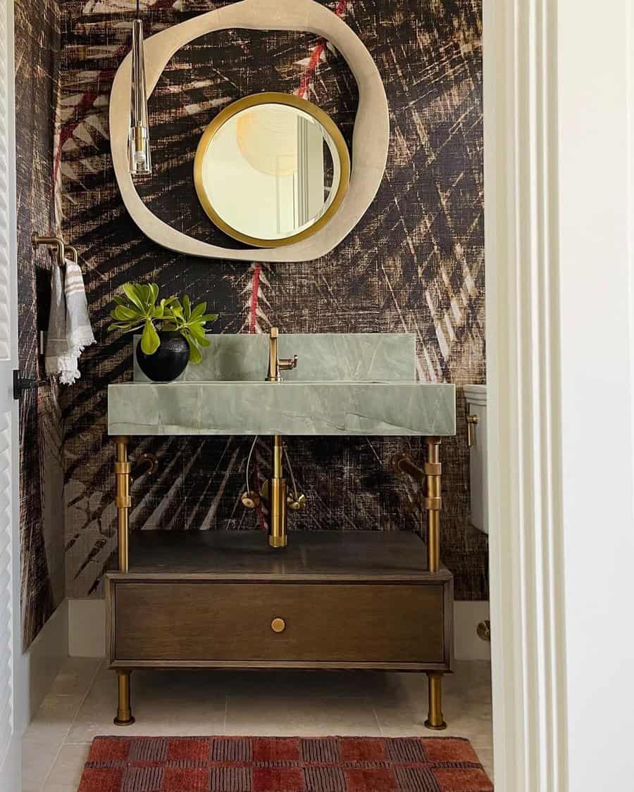 Powder room with round accent mirror