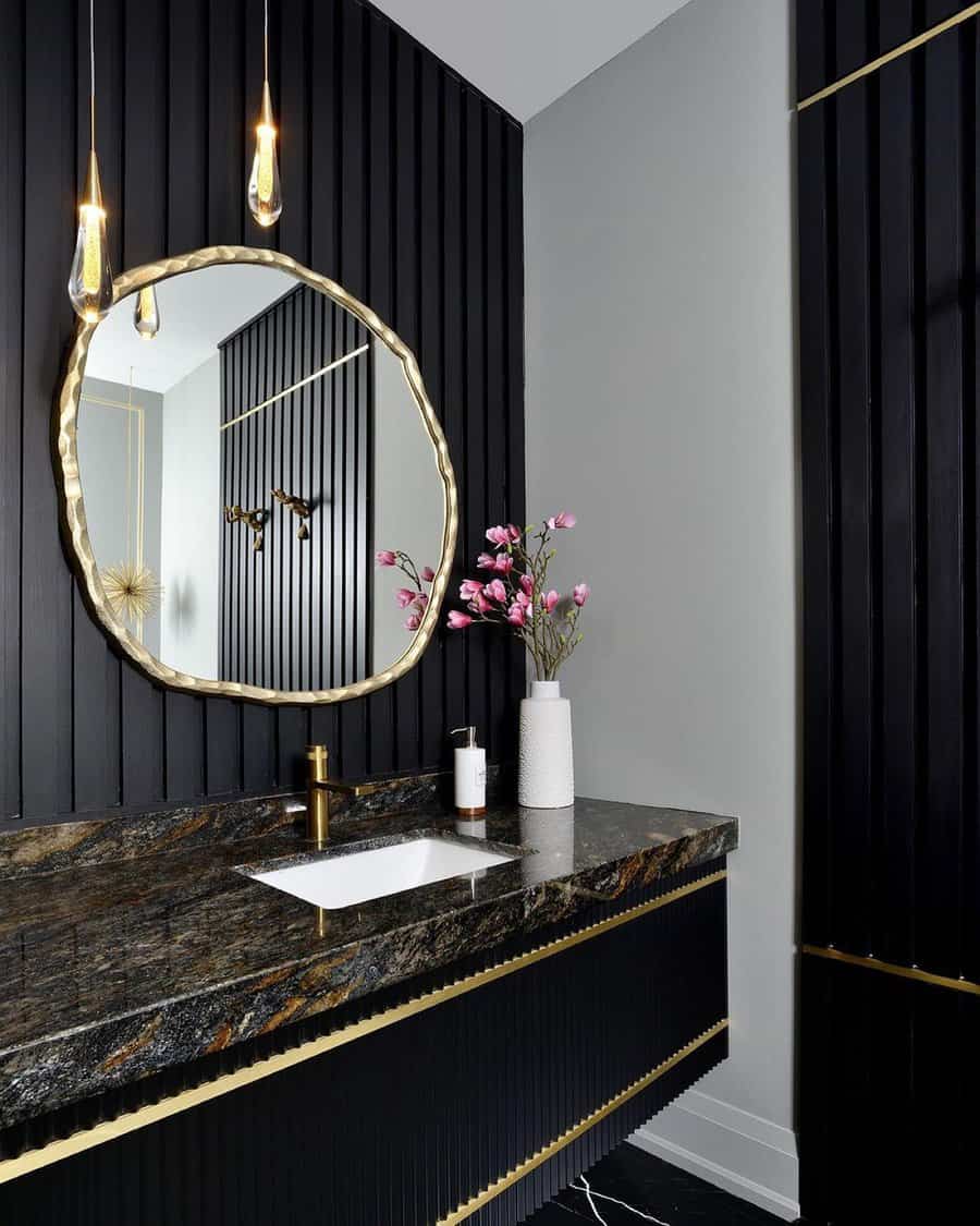 powder room with round accent mirror