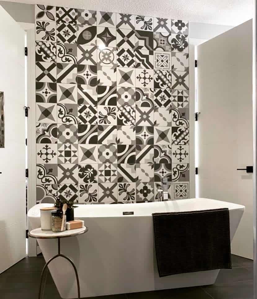 Black and white decorative tiled bathroom wall