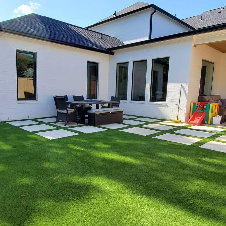 Artificial turf with square concrete pavers