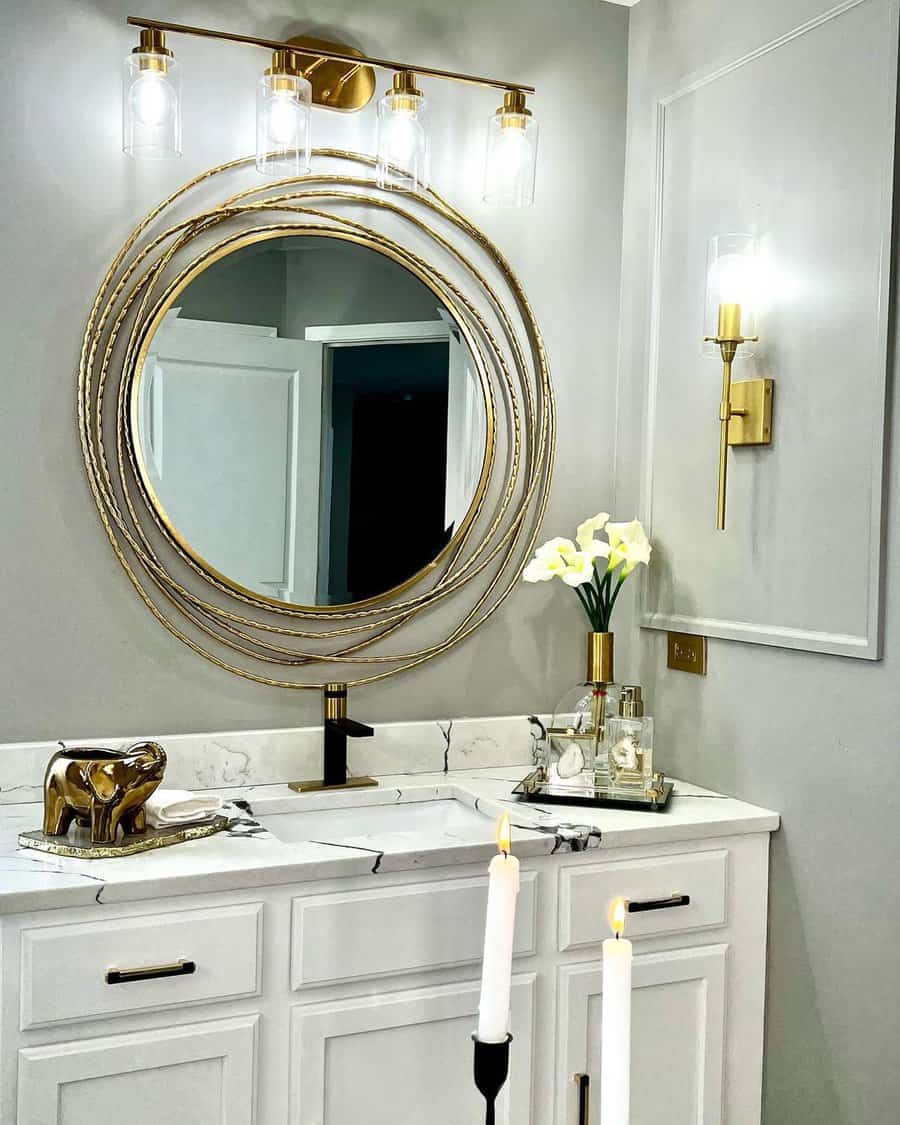 powder room with round accent mirror