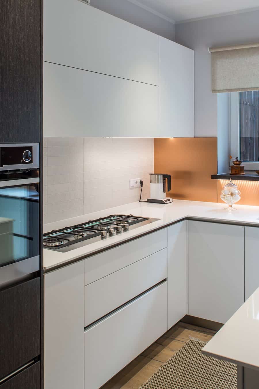 white kitchen cabinets with subway tile backsplash