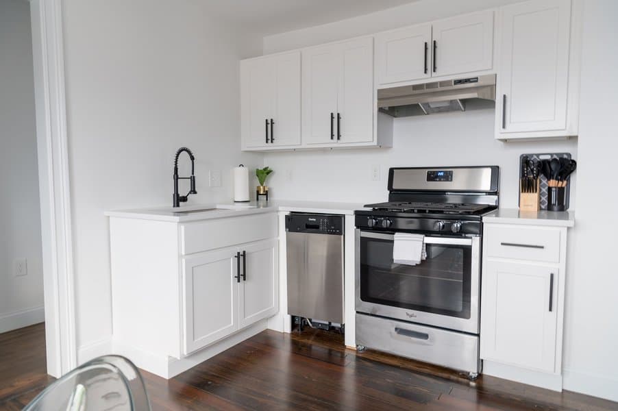 white cabinets with black handles