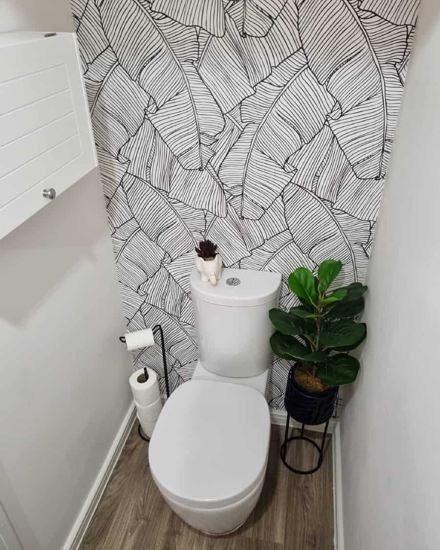 Decorative wallpaper bathroom wall with black and white leaves