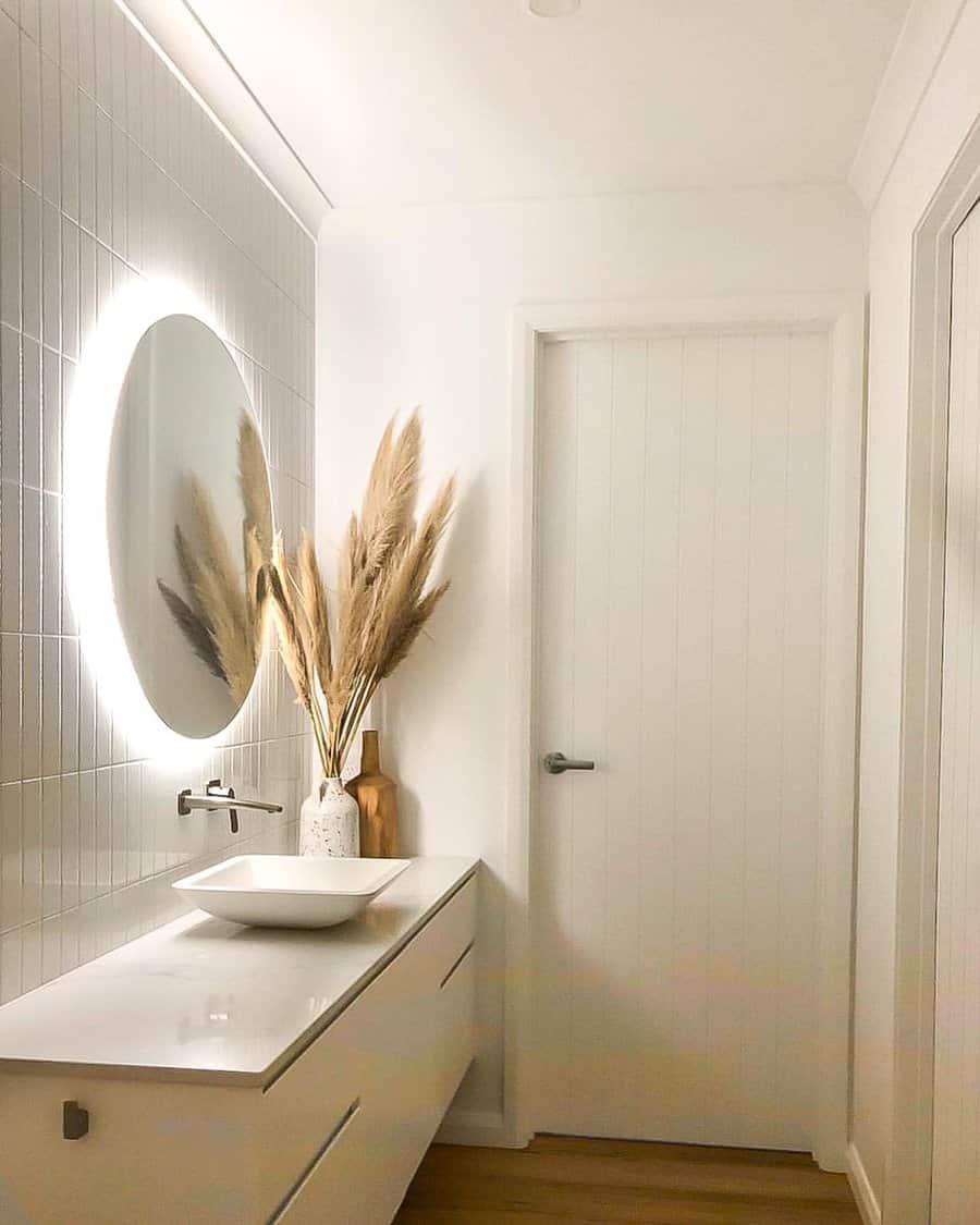 White bathroom with round LED mirror