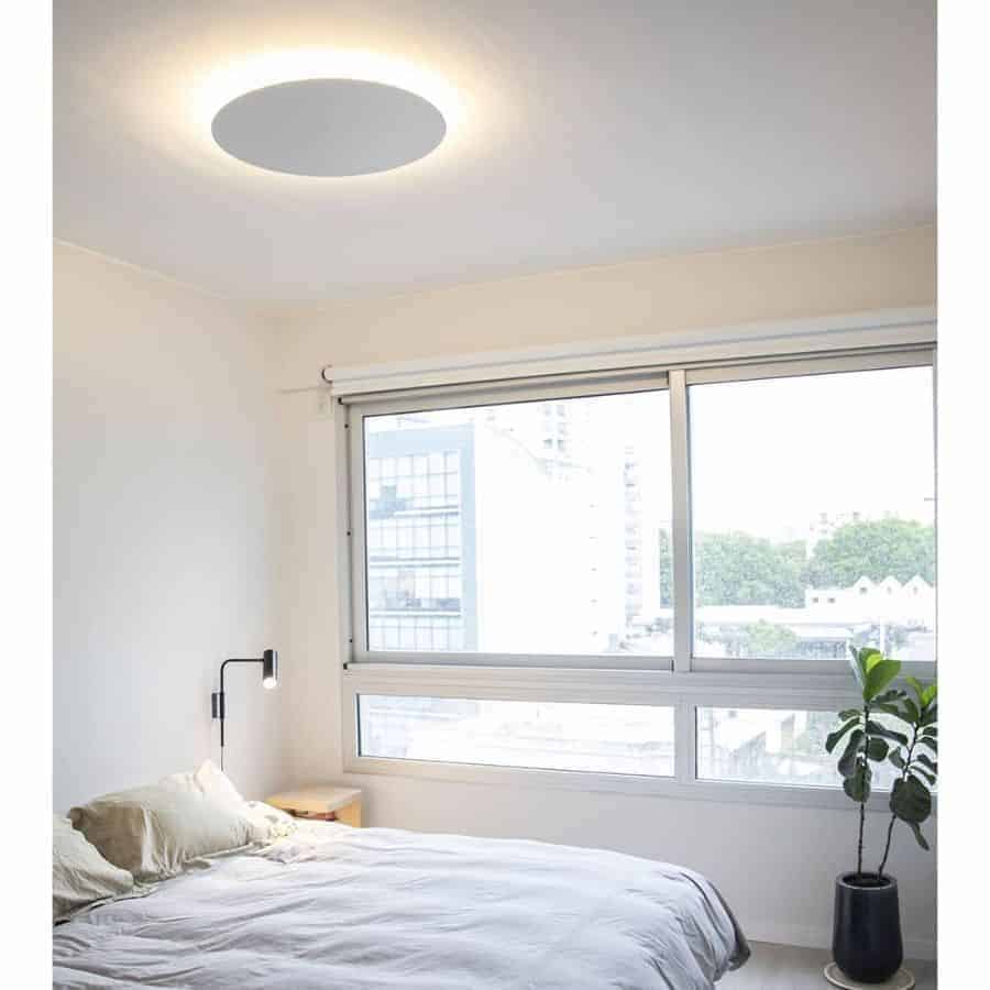 white bedroom with large windows