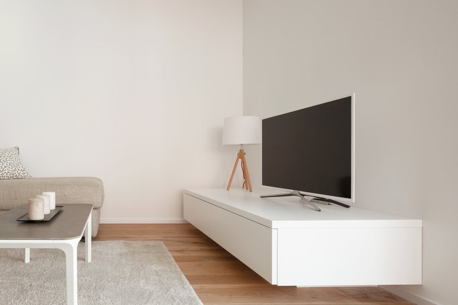 area rug in a living room with a TV