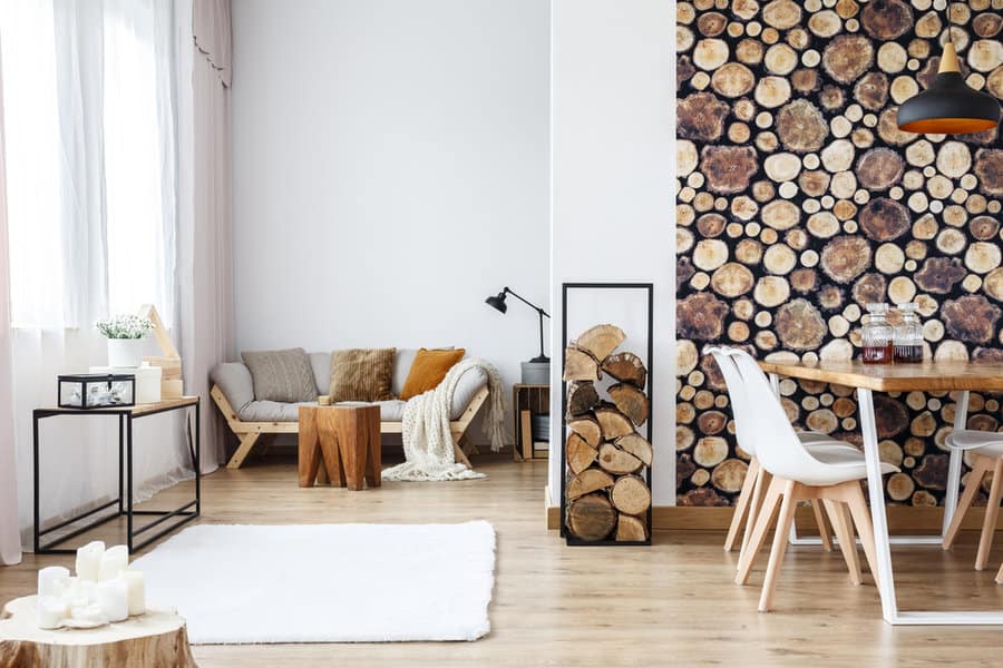 Bright room with log slice wall and modern furniture
