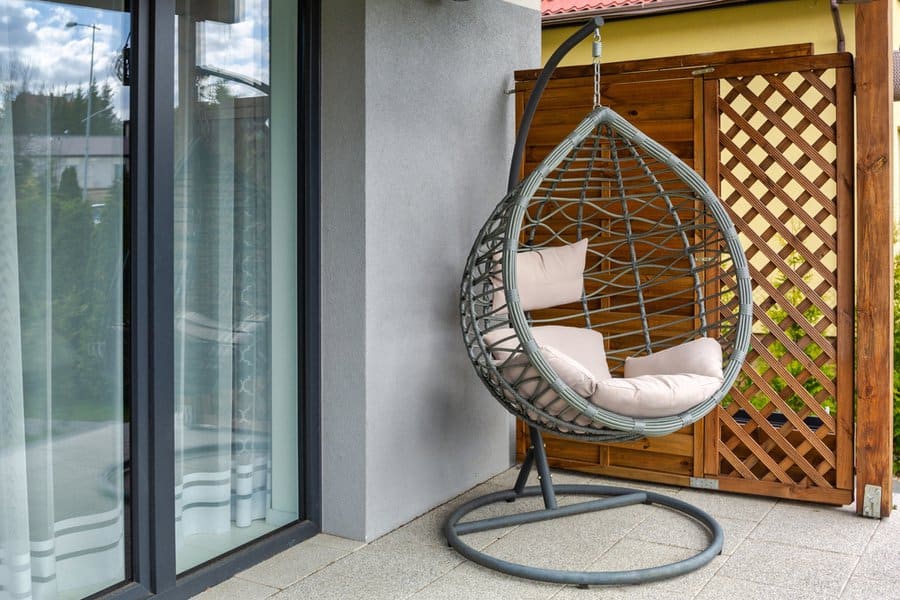 Hanging rattan chair with stand