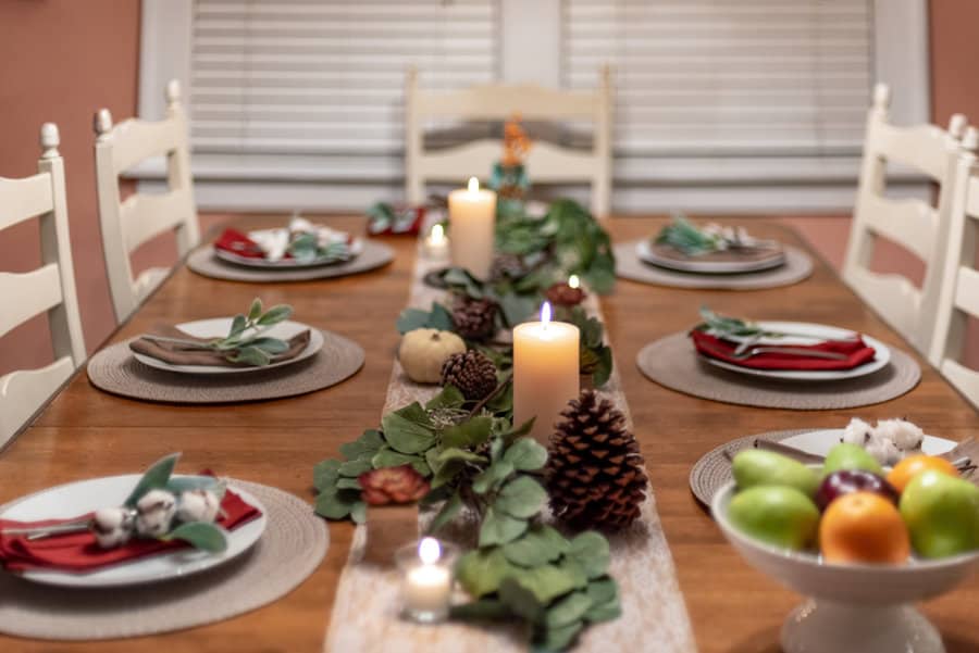 Holiday table with candles and natural decor